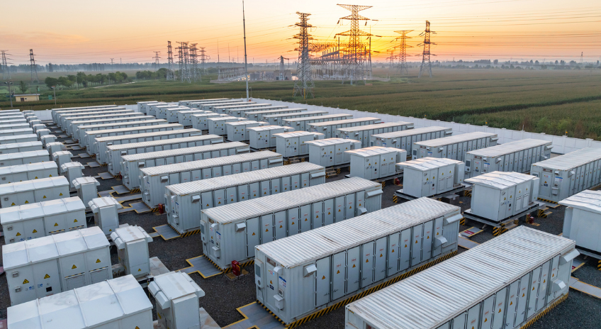 Aerial view of a battery storage facility at sunrise